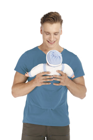 Man holding a baby doll against a white background