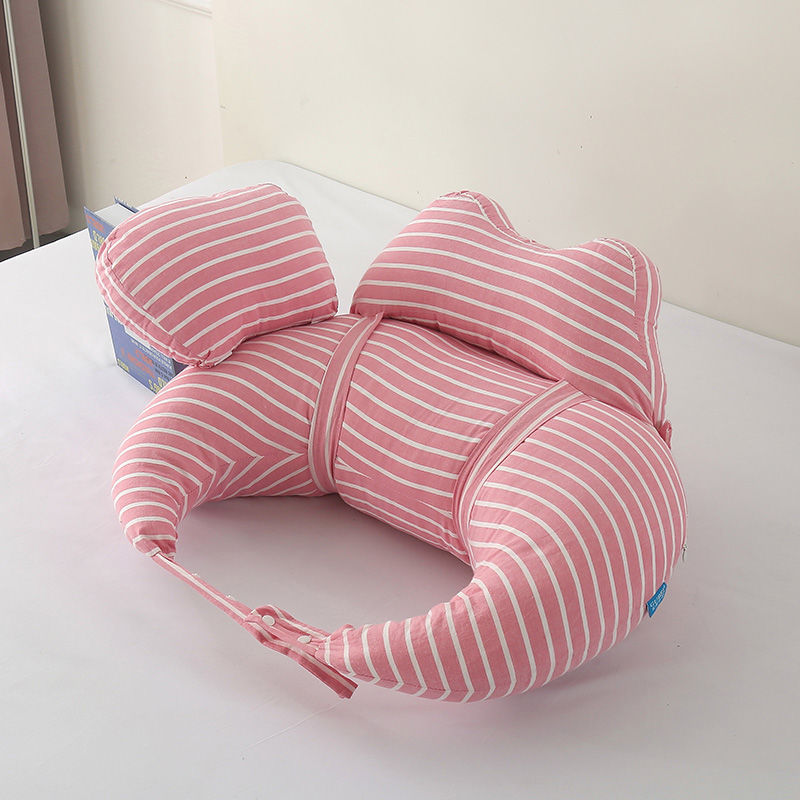 Pink striped U-shaped pillow on a white surface