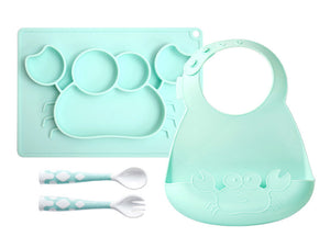 Mint green baby feeding set with bib, tray, spoons, and fork on a white background