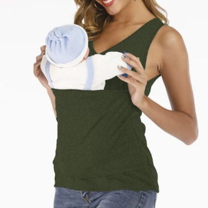 Woman holding a baby wrapped in a white blanket with blue trim against a white background