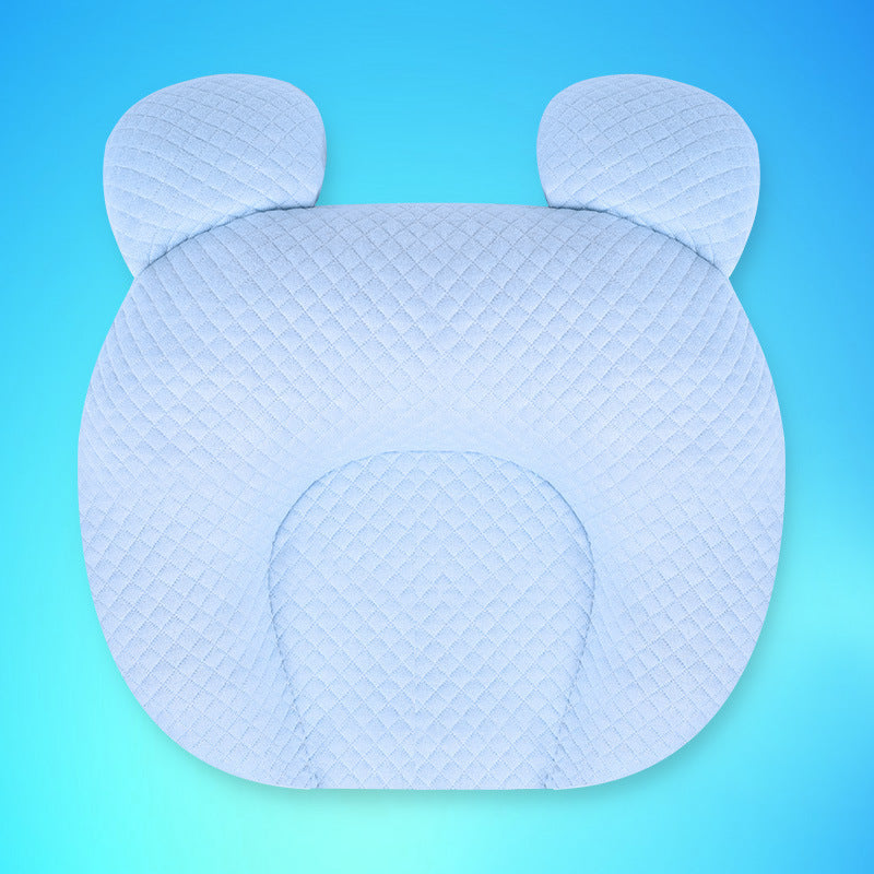 Blue baby pillow with bear ears on a blue background