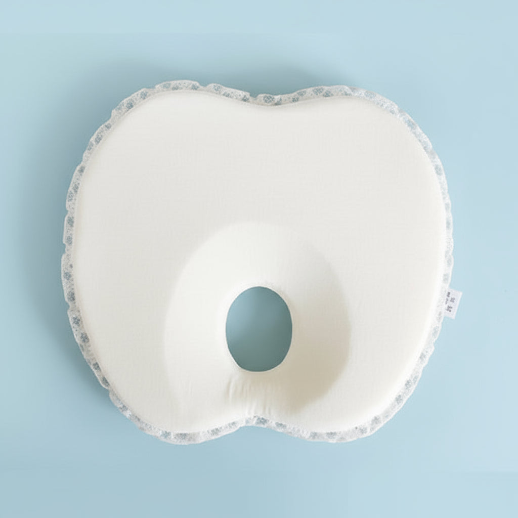 A collage of four images showing a heart-shaped newborn baby anti-flat head and positioning pillow. The top left image displays the pillow with decorative patterns.