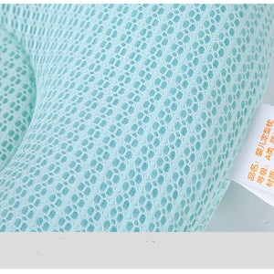 Close-up of textured turquoise fabric with a tag on a white background
