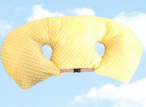 Yellow U-shaped pillow against a blue sky with clouds