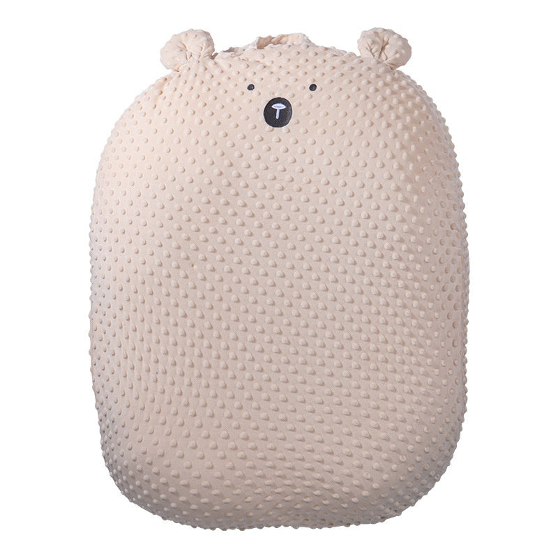 Beige textured pillow with bear face design on a white background