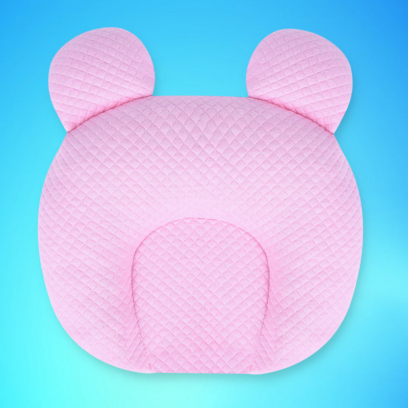 Pink pillow with bear ears on a blue background