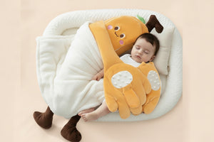 Child holding a plush banana-shaped toy with 'Shiada' branding on a white background