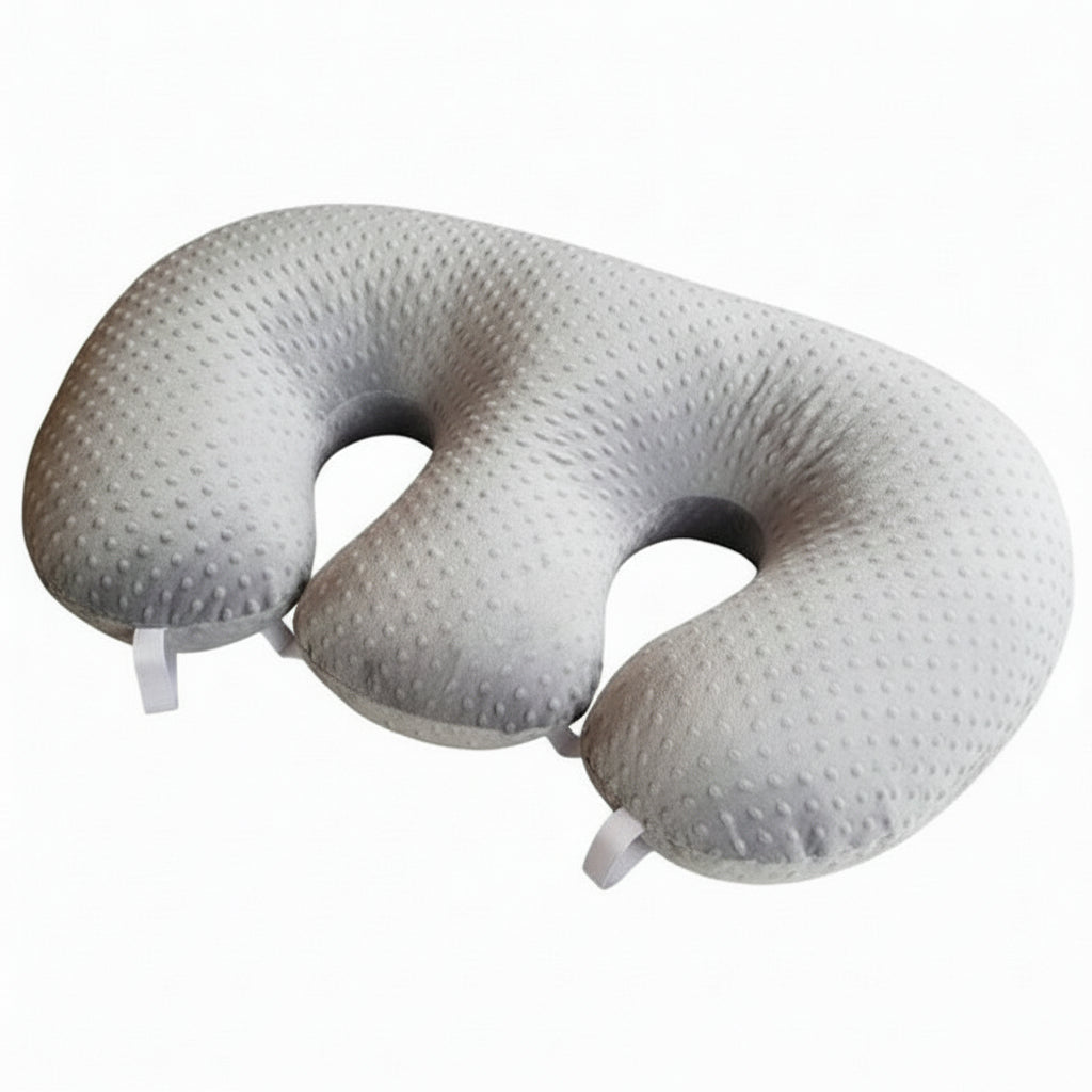 Silver U-shaped travel pillow on a white background