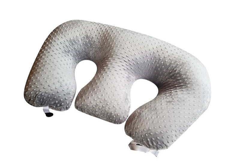 U-shaped travel pillow with textured surface on a white background