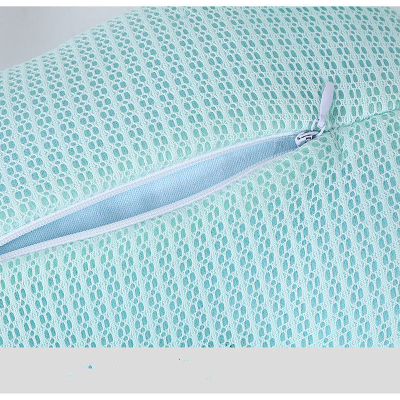 Close-up of a textured fabric with a zipper on a light blue background