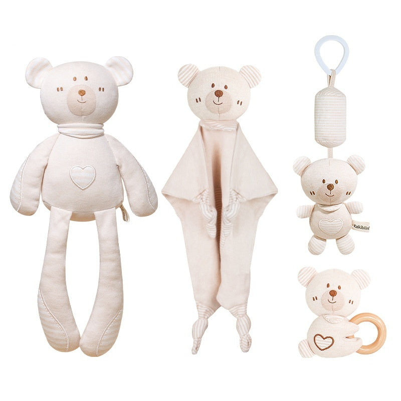 Set of four cream-colored teddy bear toys on a white background