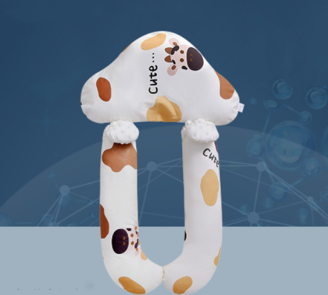 U-shaped plush toy with cow pattern on a blue background