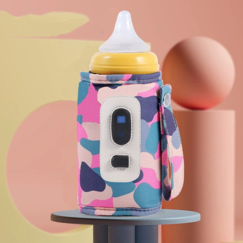Colorful baby bottle cooler with a pink and blue pattern on a pastel background