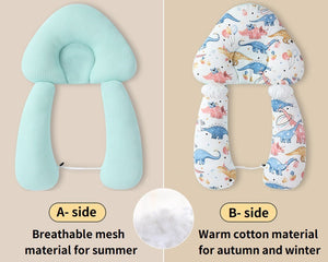 Two baby head support pillows, one green with breathable mesh and one patterned with dinosaurs, on a beige background.
