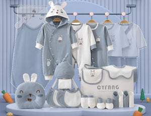 Baby clothing set with various items on a display stand, featuring a blue theme.
