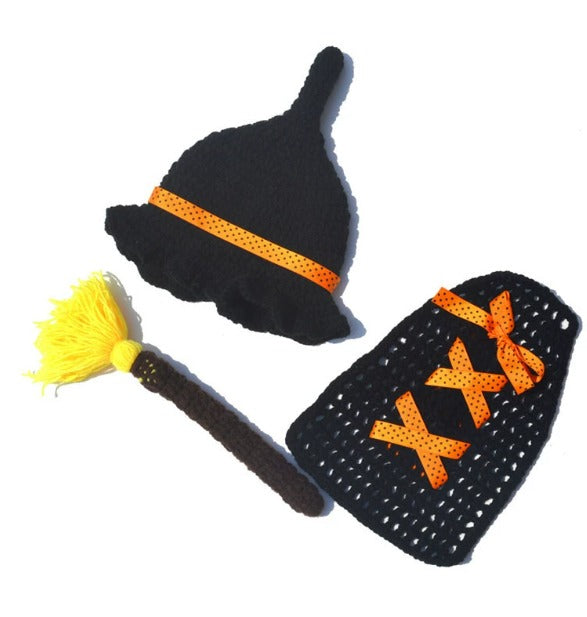 Halloween-themed crochet set with black hat, broom, and bag with orange text on a white background
