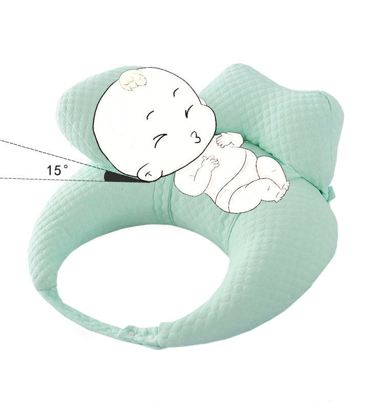 Green baby pillow with a baby illustration on a white background