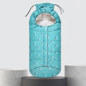 A turquoise baby sleeping bag with a small geometric pattern, shown on a pedestal with dimension markings of 102cm in height and 43cm in width, along with a blue circular graphic indicating suitability for -5 to -10°C autumn and winter.