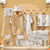 Baby clothing set with cartoon designs on a wooden display, featuring a brand name.