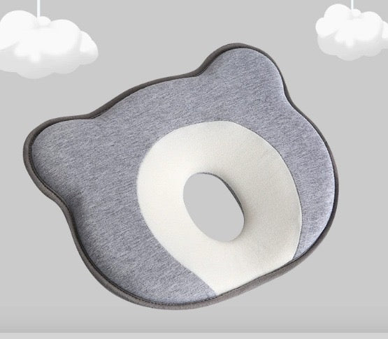 Round gray and white rug on a light gray background