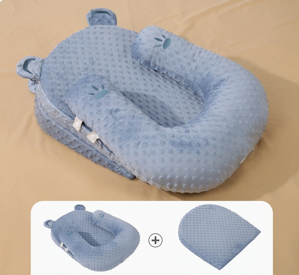 Blue baby nest with a bear design on a beige background