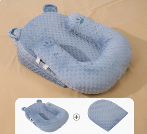 Blue baby nest with a bear design on a beige background