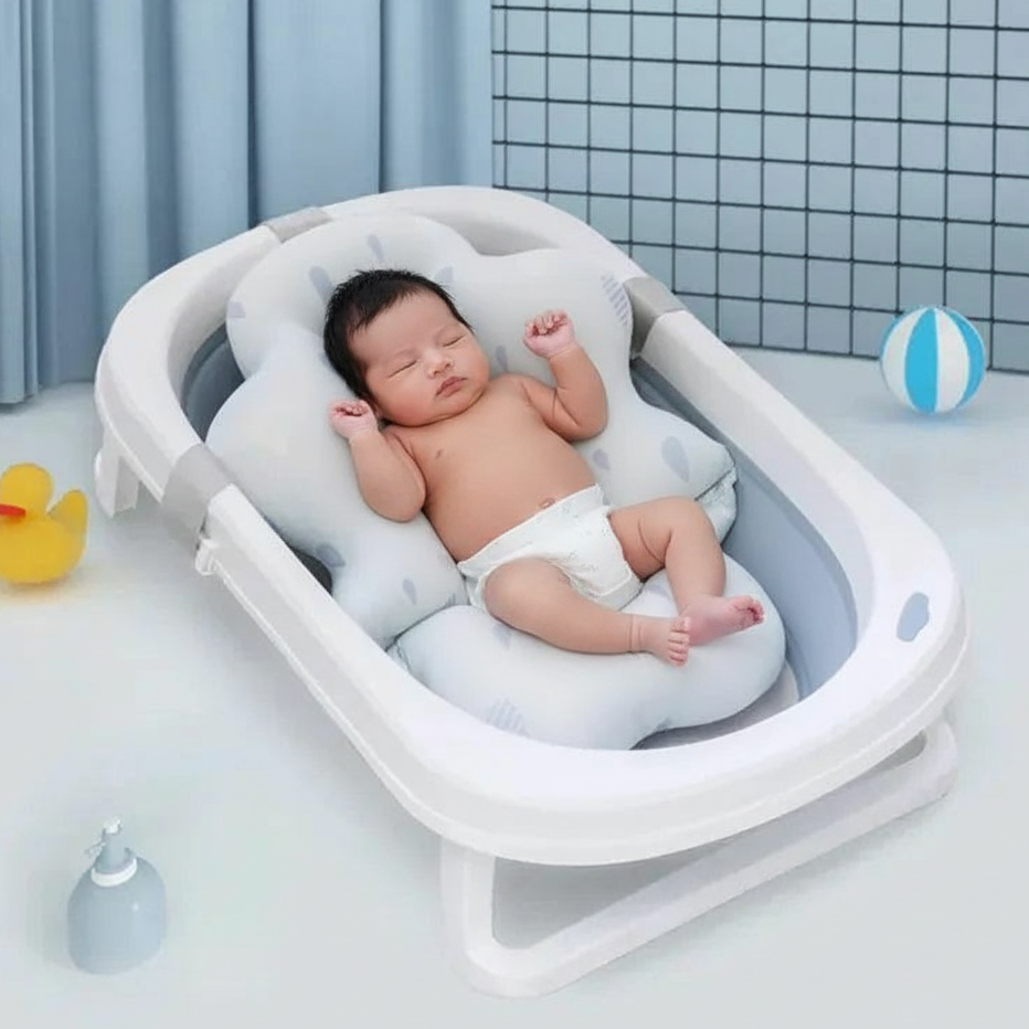 Baby lying in a white baby bathtub with blue tiles in the background