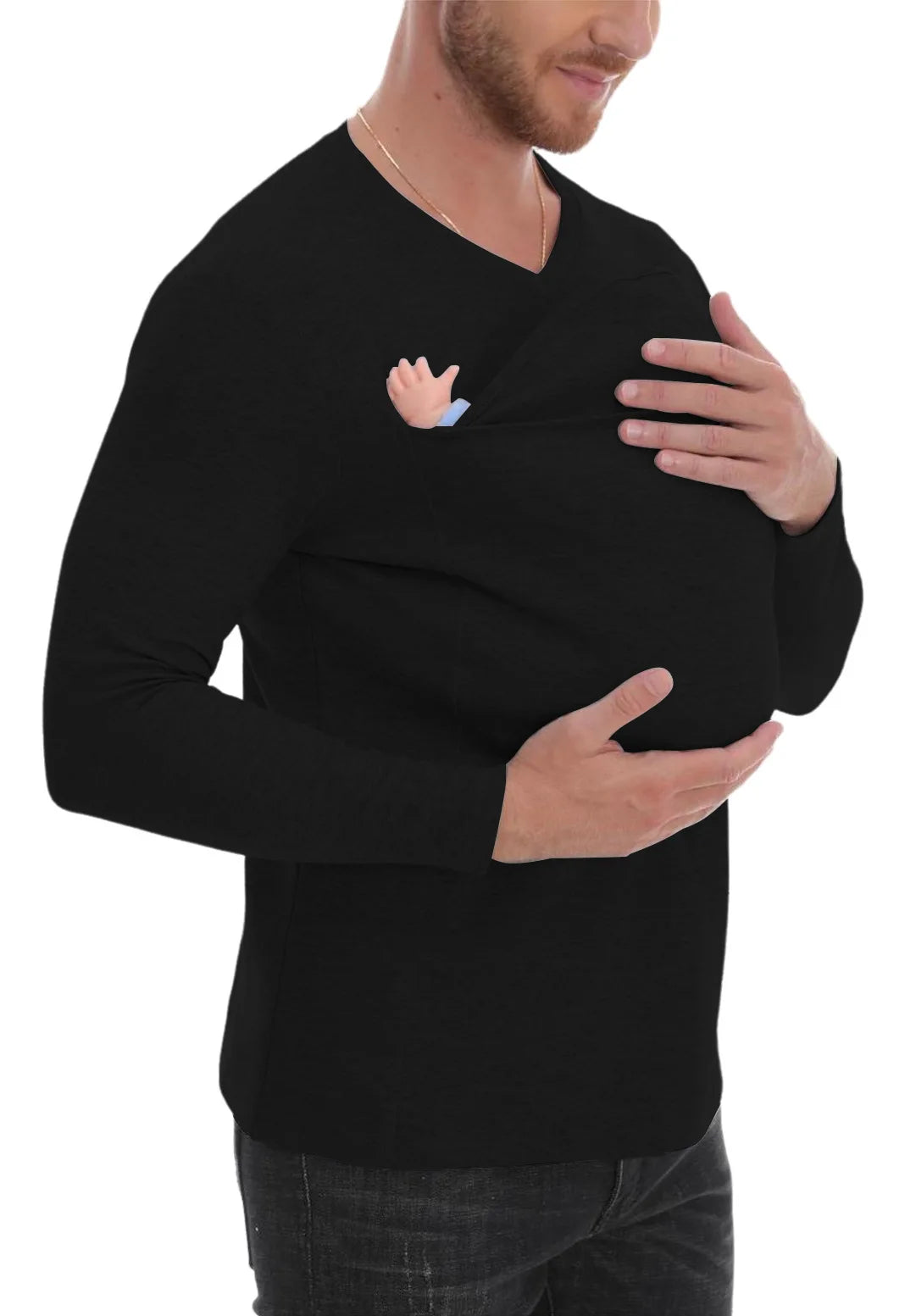 A man wearing a black long-sleeved baby carrier shirt with a baby in it, designed for hands-free bonding.