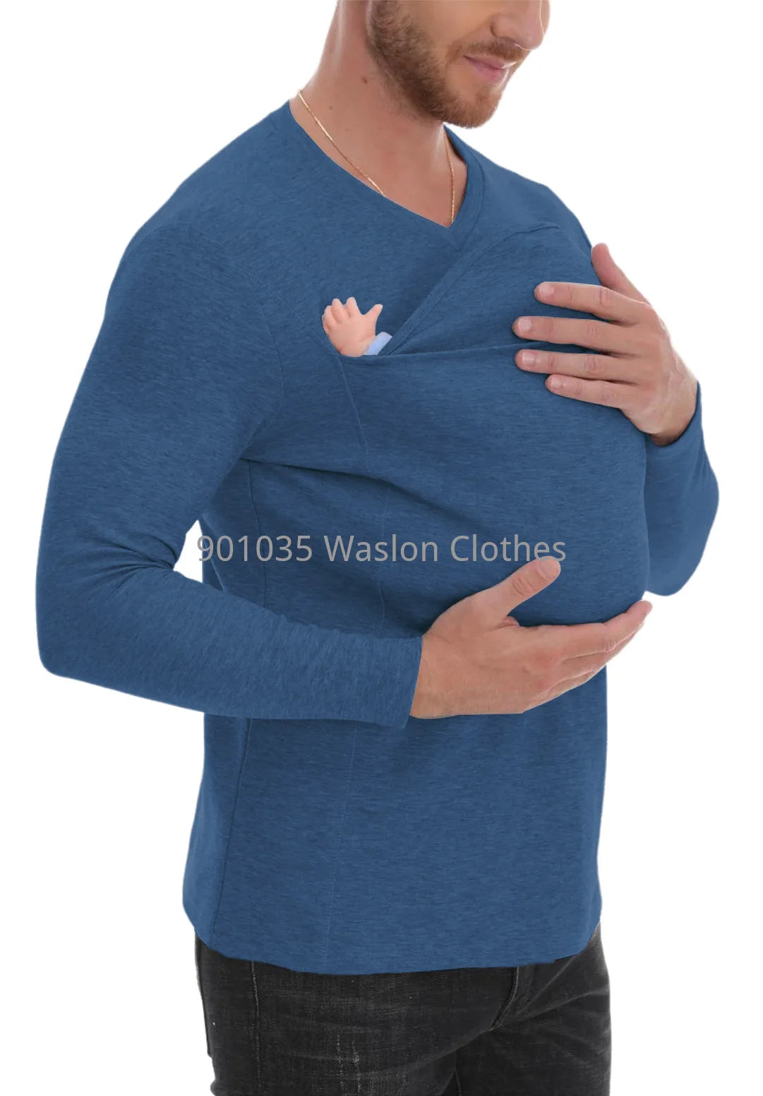 A man wearing a black long-sleeved baby carrier shirt with a baby in it, designed for hands-free bonding.