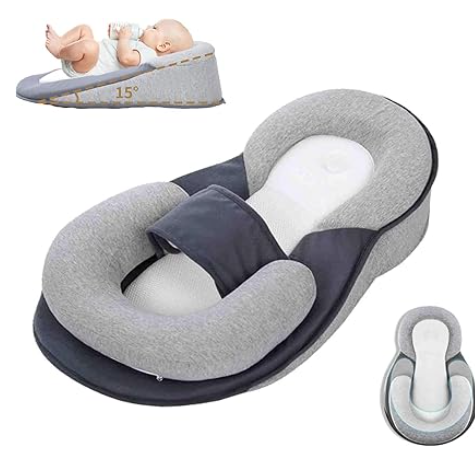 Baby support seat with adjustable headrest and small baby doll on a white background