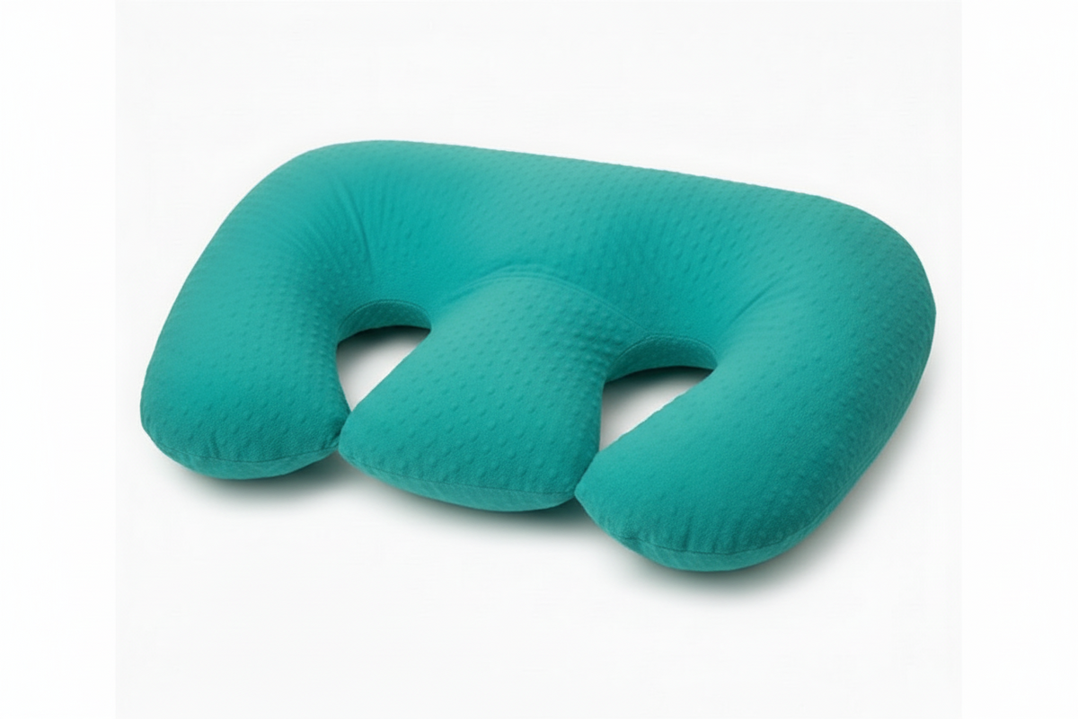 Teal U-shaped travel pillow on a white background