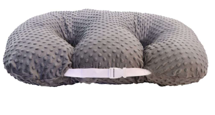 Gray textured pillow with a strap on a white background