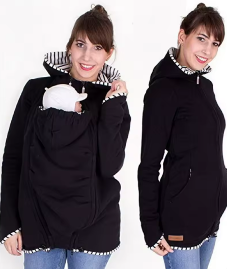 Black hoodie with zebra-striped hood worn by a person on a white background