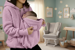 Person wearing a pink fleece jacket holding a baby, with a flame icon indicating warmth.