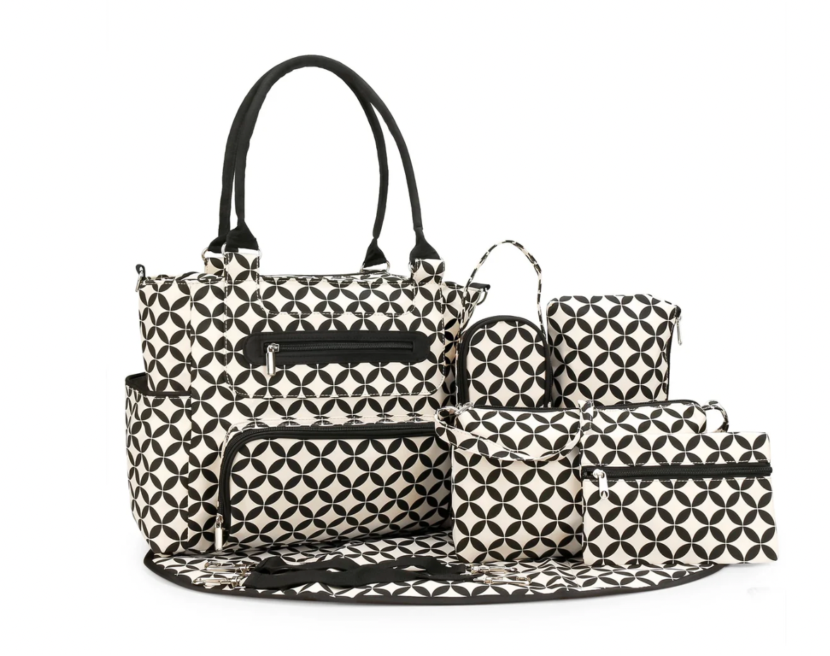 Black and white geometric patterned diaper bag set on a white background