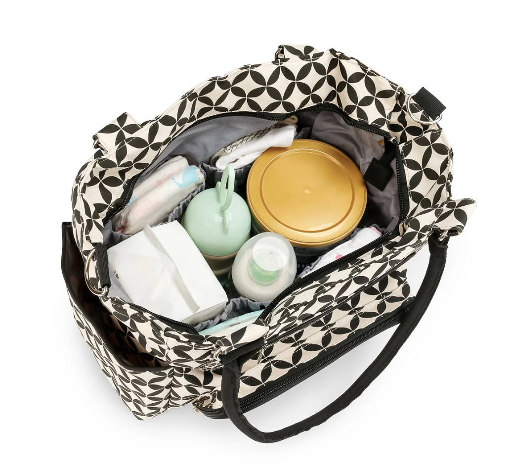 Patterned tote bag with baby bottles and items on a white background