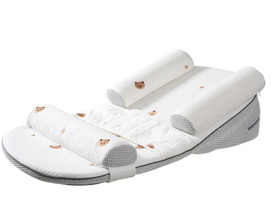 A white baby travel pillow set with quilted cushioning, breathable mesh side panels, and small teddy bear face prints, displayed on a clean white background.