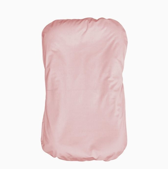 Pink strapless top on a white background