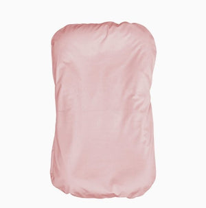 Pink strapless top on a white background