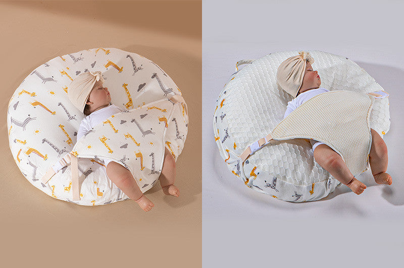 A newborn lounger pillow with a printed design, featuring a baby lying on it in a supine position.