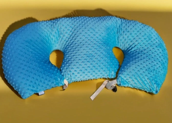 Blue travel pillow on a yellow background