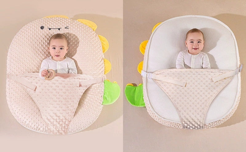 Baby wrap with dinosaur design on a beige background