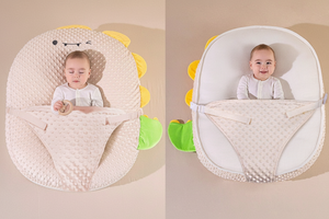 Baby in a dinosaur-shaped baby seat on a beige background