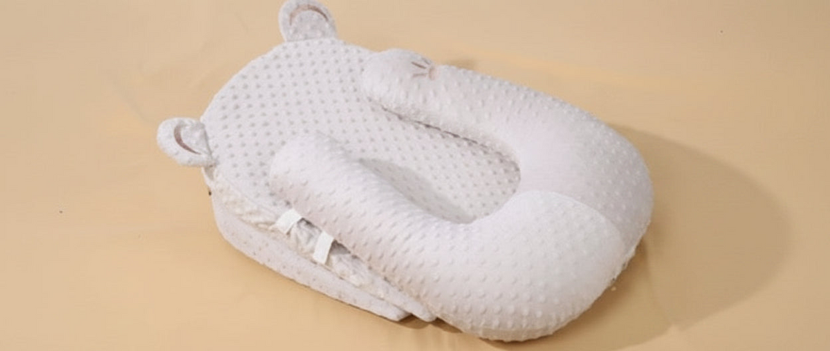 White textured pillow on a beige background