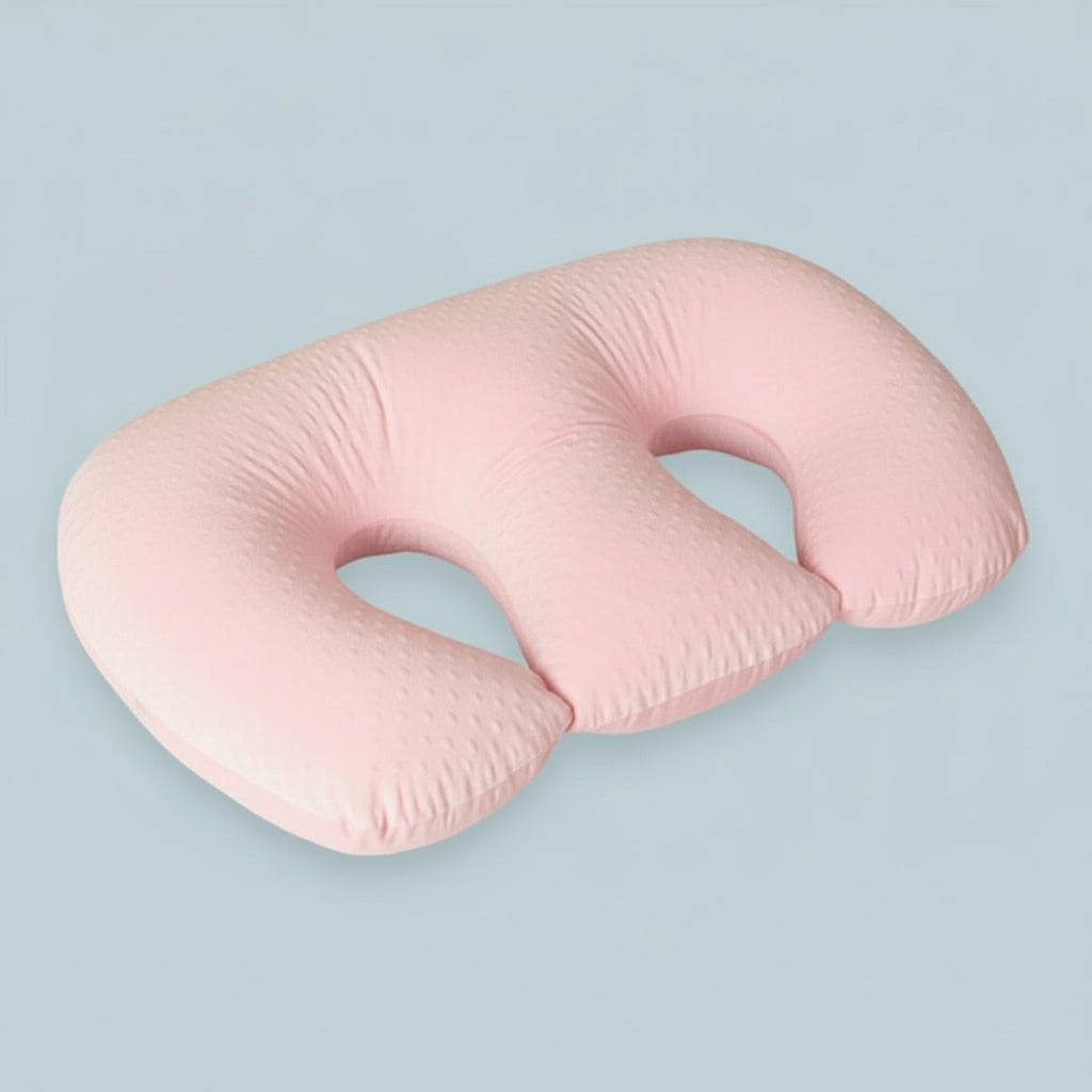 Pink U-shaped pillow on a white background